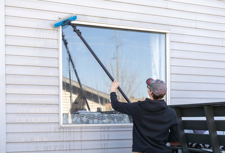 Person washing a window