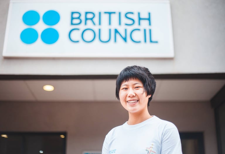 a woman in a white shirt and a blue shirt