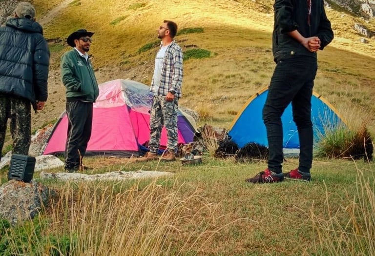 Tents set up on Khyber Sar Mountain with panoramic views of the Hunza Valley camping