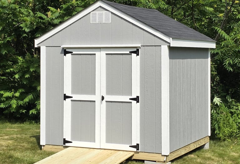 Custom 8x8 wooden shed built in Massachusetts, perfect for garden tools and storage.