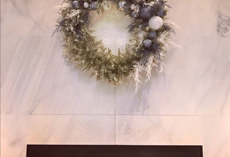 Andy Albright's wreath design hanging on a wall.