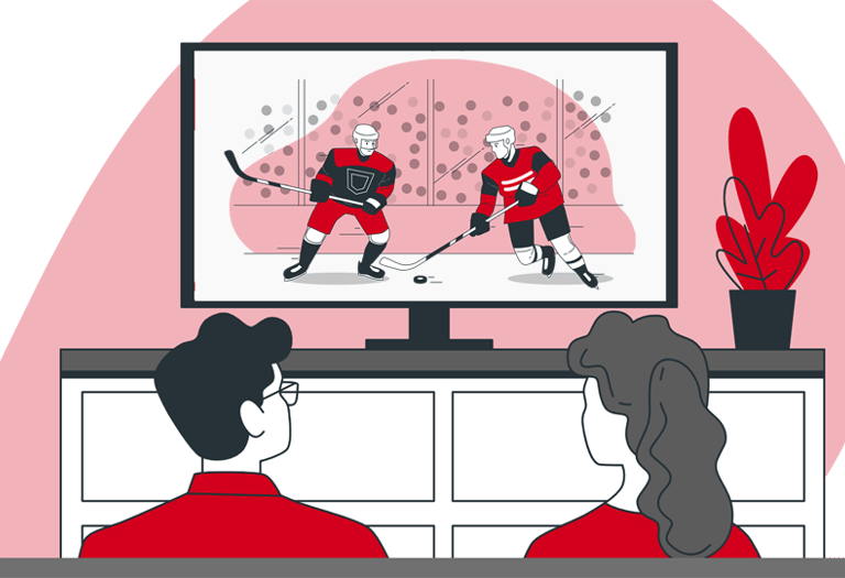 a couple sitting on a couch watching streaming sports game on their large screen TV