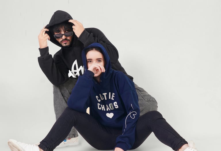 2 people wearing customized hoodies