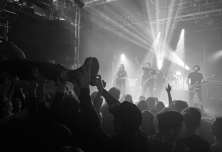 a band playing a concert in a dark room