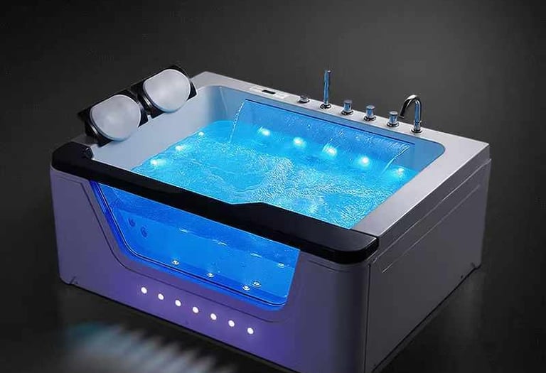 a bathtub with a blue led light and a blue light
