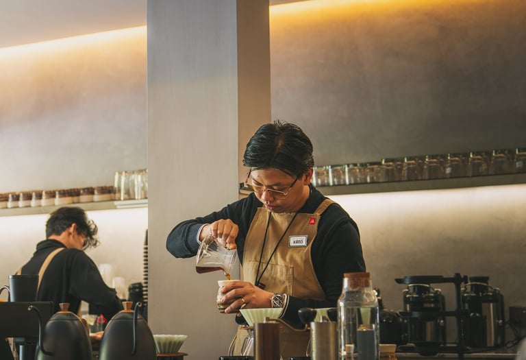 Barista making coffee at Grind Now Coffee Bar in Batam