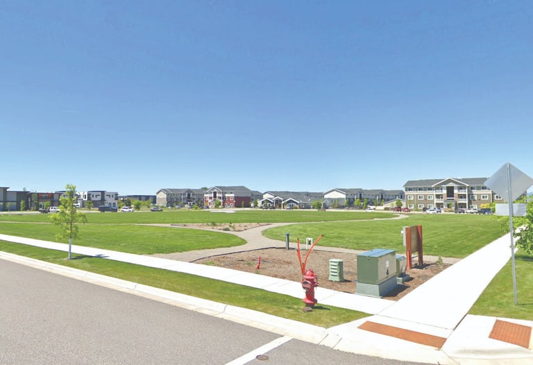 a park with a playground structure and a playground structure