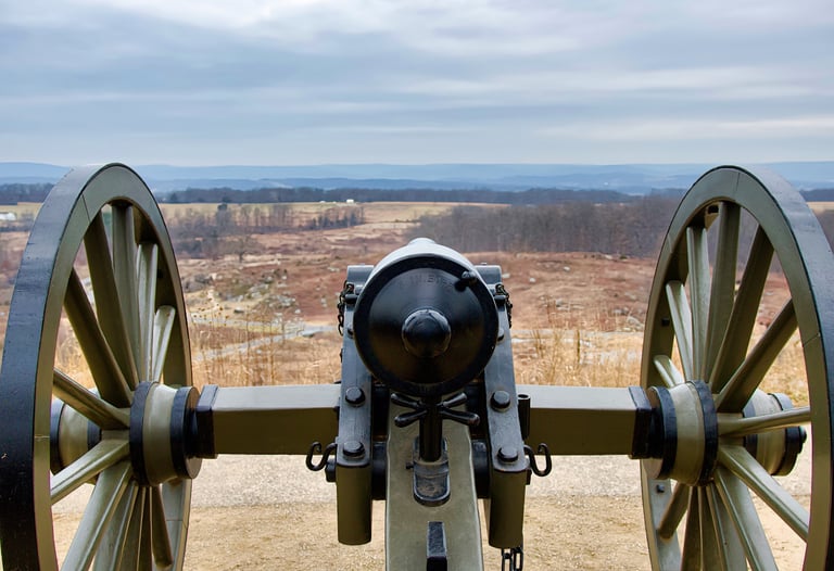 Historic Civil War cannon on Little Round Top overlooking the Gettysburg National Military Park battlefield.