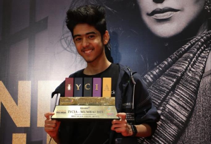 a man holding a plaque that says,'one of the best in the world