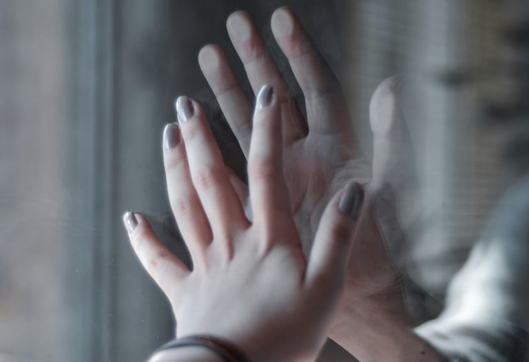 a person holding their hands up to a person's hand