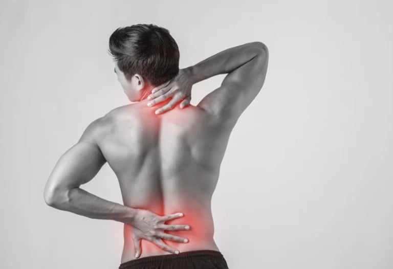 Person holding neck and lower back with red highlights showing pain and discomfort in spine area