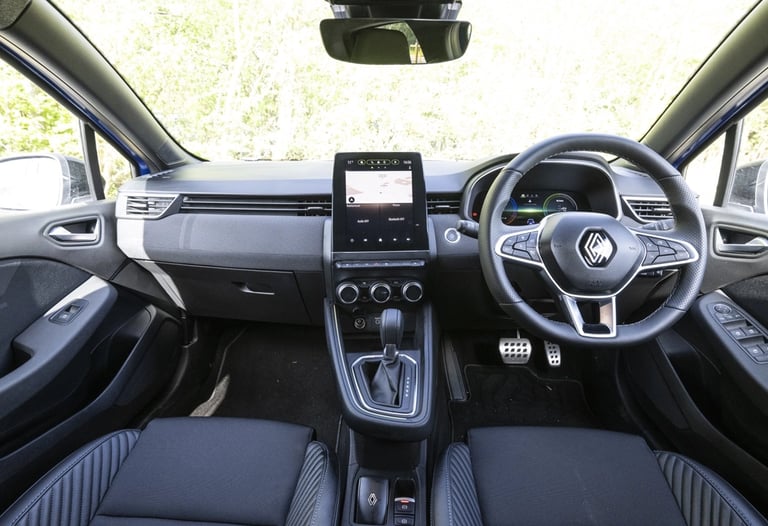 a car dashboard with a steering wheel and steering wheel