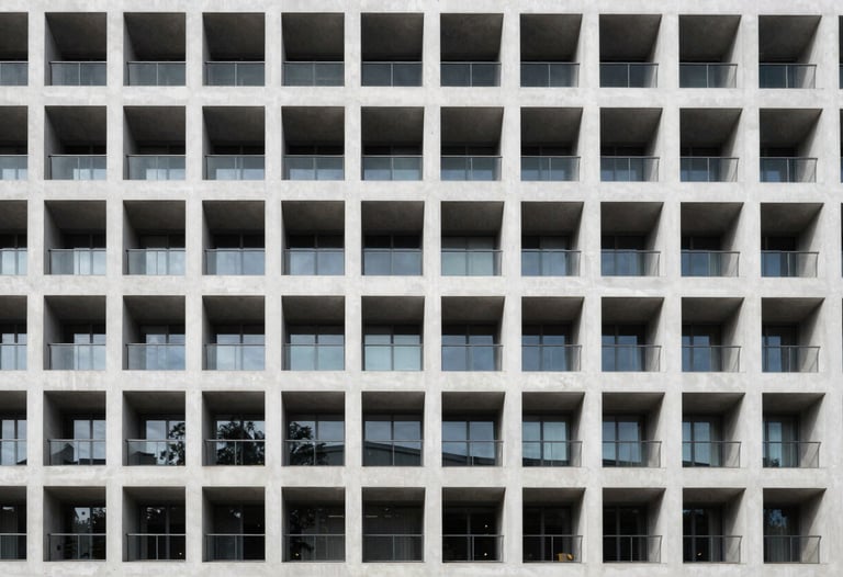 Minimalist architectural photography of a modern building facade in France, emphasizing symmetry and professional clarity.