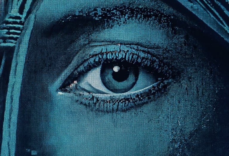 A macroscopic shot of digital pixels on a professional monitor, showing the complexity of the digital image structure. Muted teal and navy tones.