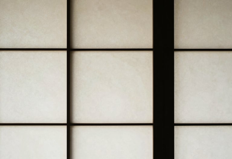 Abstract photography of light and shadow on a traditional shoji screen. Minimalist composition in off white and black.