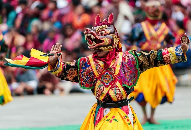 masked_dancer_potraying_meaningful_hand_gestures_during_annual_religious_masked_dance_festival_in_th