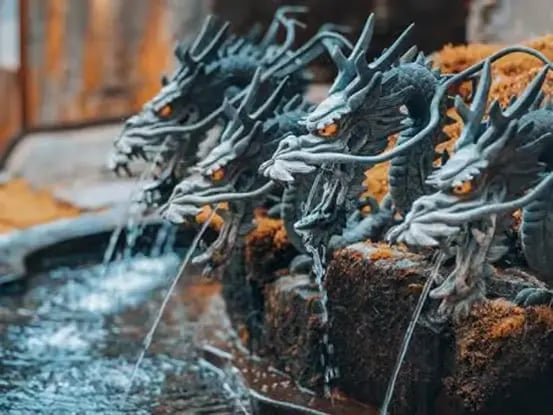 Dragon-shaped water fountain at a Japanese shrine near Mount Fuji.