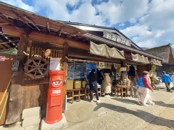 Traditional wooden shop and red post box in Takayama Old Town