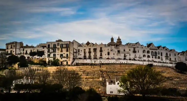 Locorotondo hilltop town on terraced ridge overlooking Puglia countryside