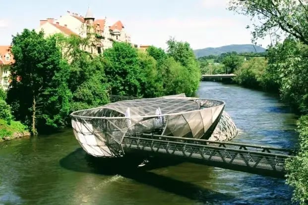 The futuristic Murinsel floating platform on the Mur River in Graz, Austria.