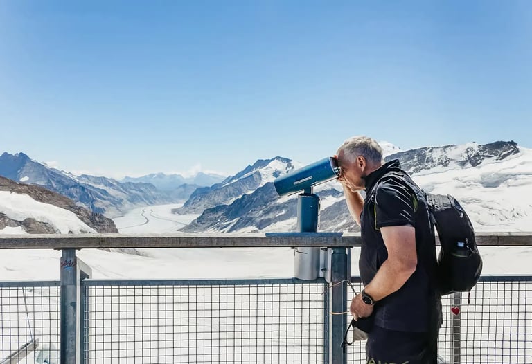 Tourist viewing Aletsch Glacier from Sphinx Observatory at Jungfraujoch Top of Europe  