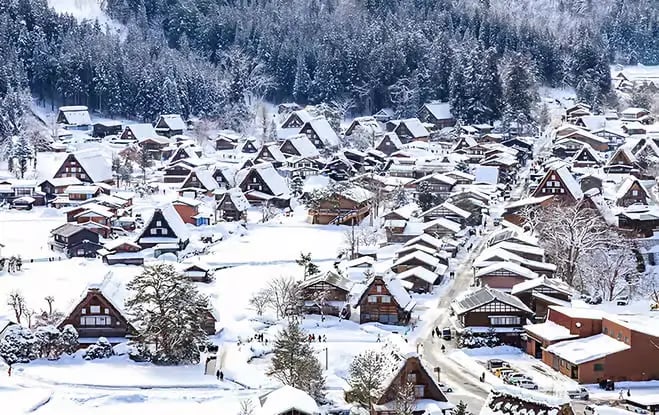 Aerial view of Shirakawa-go village covered in deep winter snow.