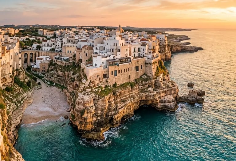Aerial view of Polignano a Mare old town on limestone cliffs at sunset