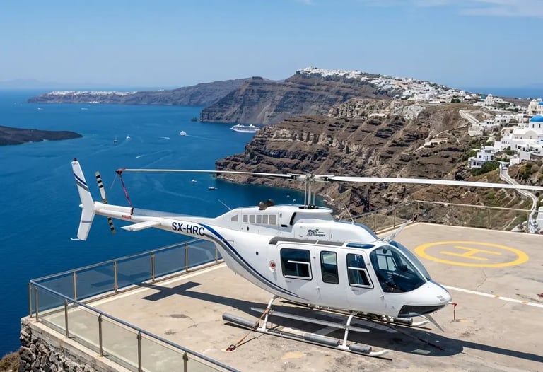 Bell 206 helicopter parked on Santorini helipad overlooking caldera and Aegean Sea