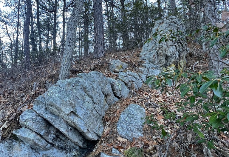a rock wall located on the spec mine trail