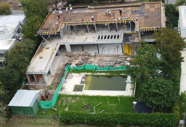 a house being built into a house with a pool and a pool