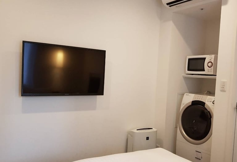Hotel room with washer and dryer
