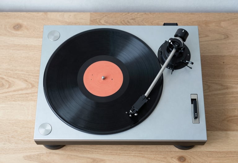 Top-down view of vinyl records and a high-end turntable on a minimalist light wood table, pale blue accents, clean and stylish.