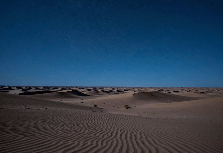 A wide photography shot of a North American desert landscape at night under a clear starry sky, lit with an artificial steel blue cinematic glow to create a speculative sci-fi atmosphere.