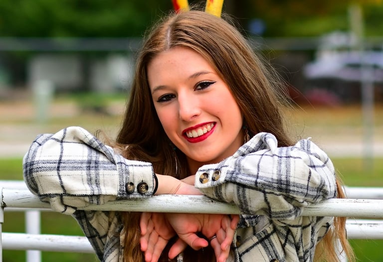 Girl shoulder/head shot shown leaning on bar