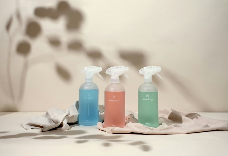 Super Sanitation cleaning bottles of cleaners and a cloth