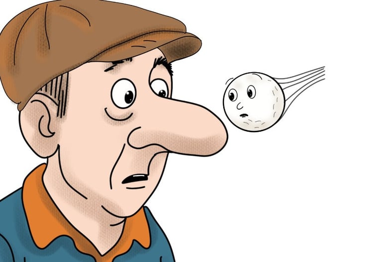 golf ball flying past the nose of a man in a cap
