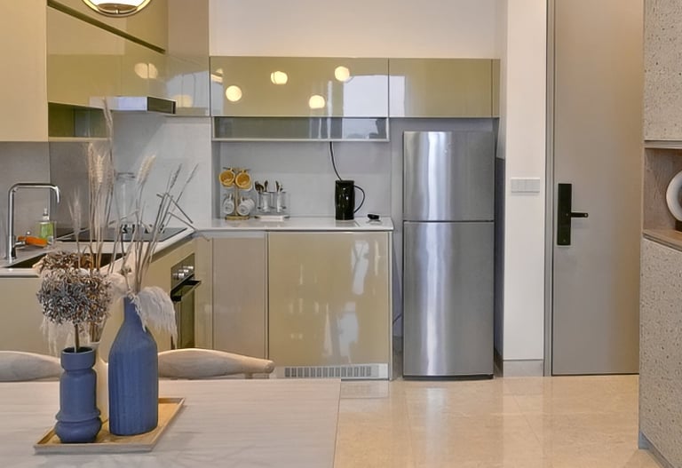 Modern kitchen and dining area with pendant lighting, stainless steel appliances, and a minimalist t