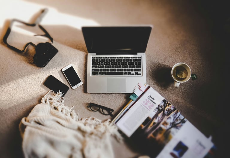 a laptop computer sitting on a carpeted floor