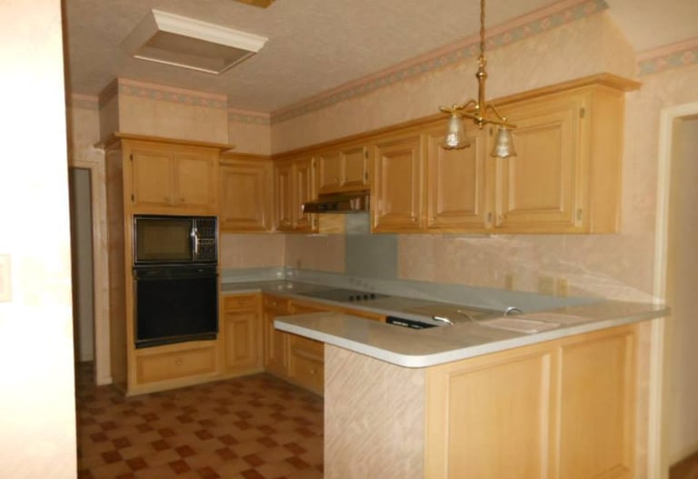 a kitchen with a stove top oven and a stove top oven