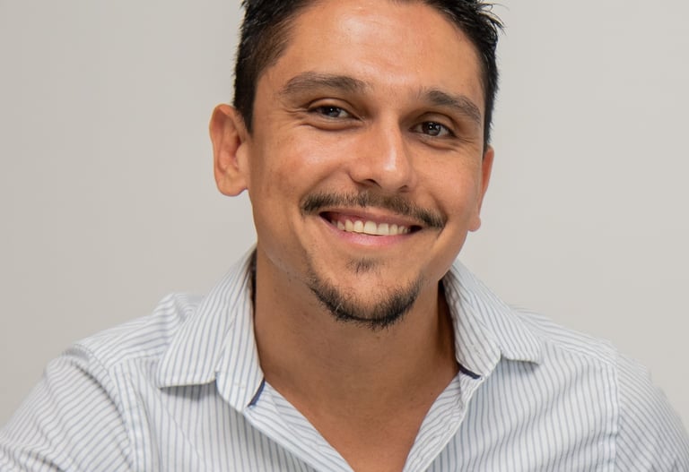 a male translator with a beard and a mustache on his face