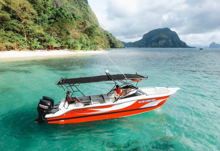 Private luxury yacht cruising through Bacuit Bay, El Nido.