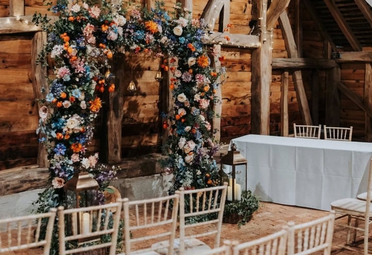 Fairy-lit wooden barn at Gildings Barns in Dorking, Surrey, wedding venue
