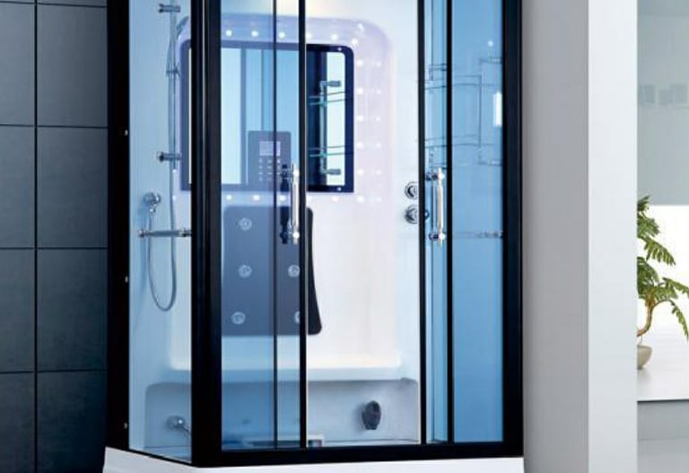 a modern shower room with a glass shower