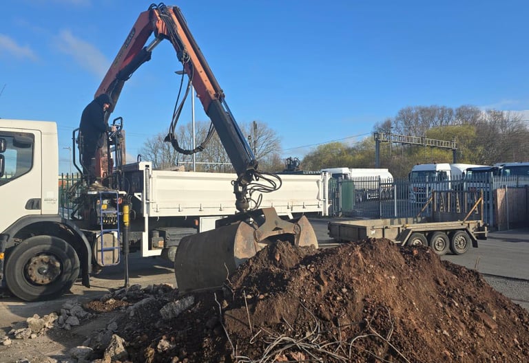 Commercial muck-away grab lorry on site in Brierley Hill, Dudley