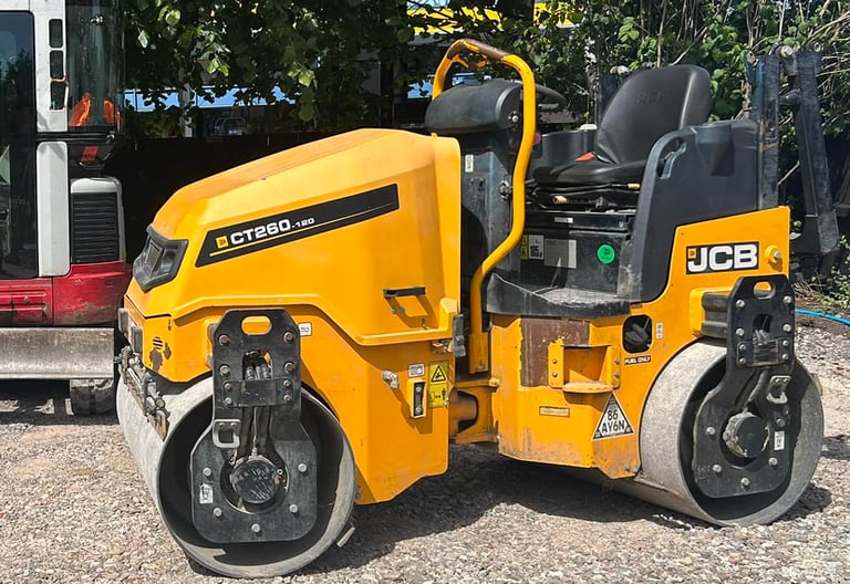 Twin-drum roller hire compacting new driveway in Dudley area