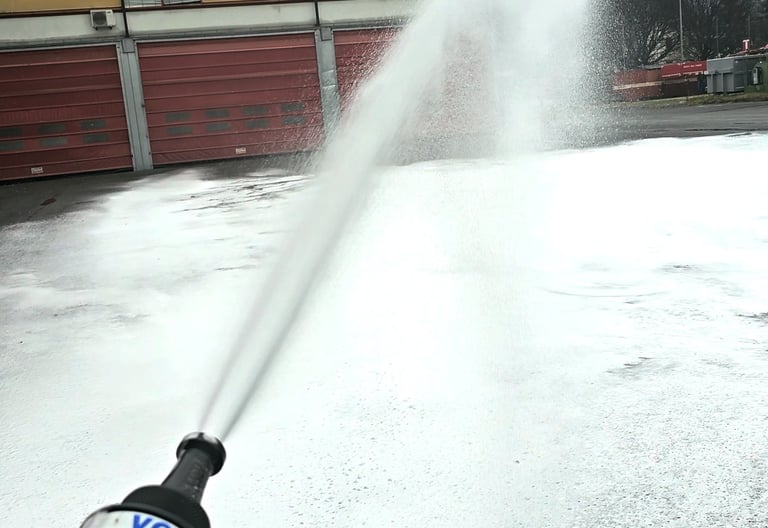 a fire hydrant spraying cafs foam out of a fire hydrant