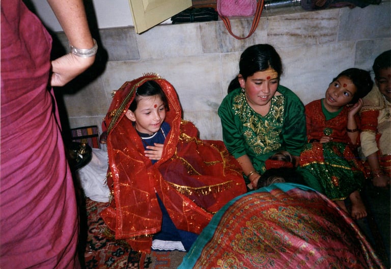 Puja to the girls, incarnations of the Divine Mother