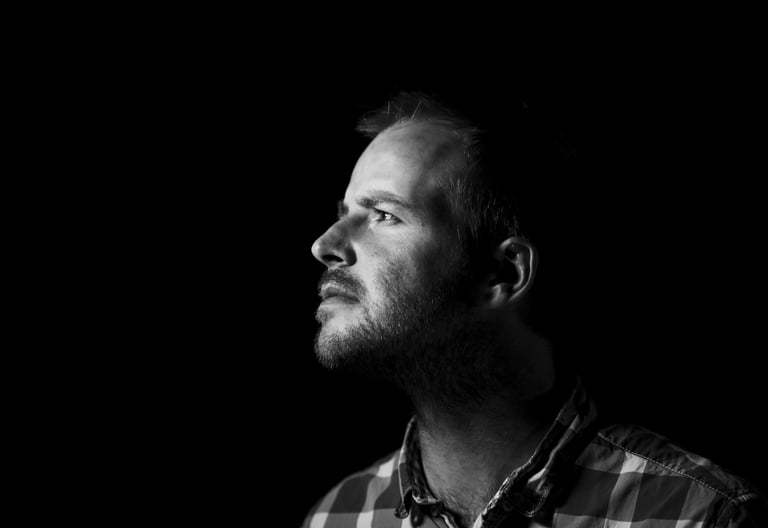 a man with a beard and a plaid shirt