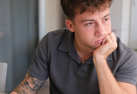 pensive twentysomething man