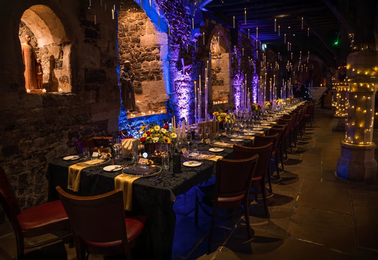 Decorated indoor event venue with dramatic blue lighting, captured by Fred Art Studio.